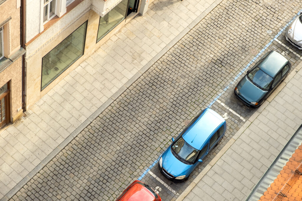 Uphill Parking Guide with Maserati Cars on Steep City Street